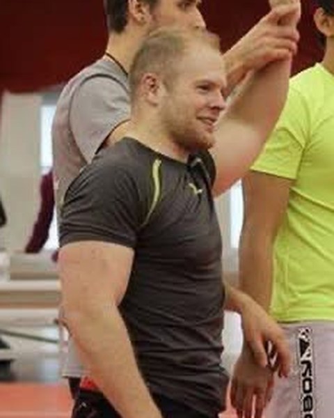 Emery Kolbrish having his hand raised after a match